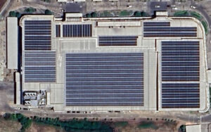 Large rooftop solar panel installation on a commercial building