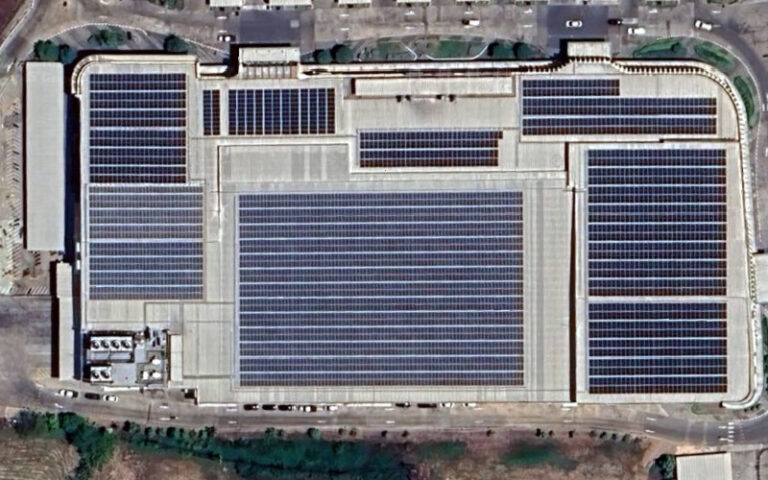Large rooftop solar panel installation on a commercial building