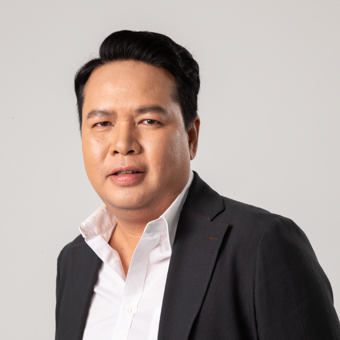 Man in a suit, possibly a business owner or executive