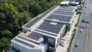 Aerial view of SB Design Square Phuket with extensive solar panels on the roof.
